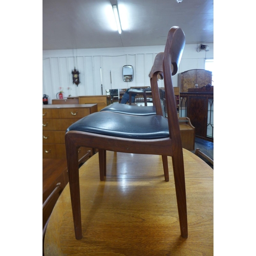 105 - A pair of Danish Neils Otto Moller model 75 teak and black vinyl chairs