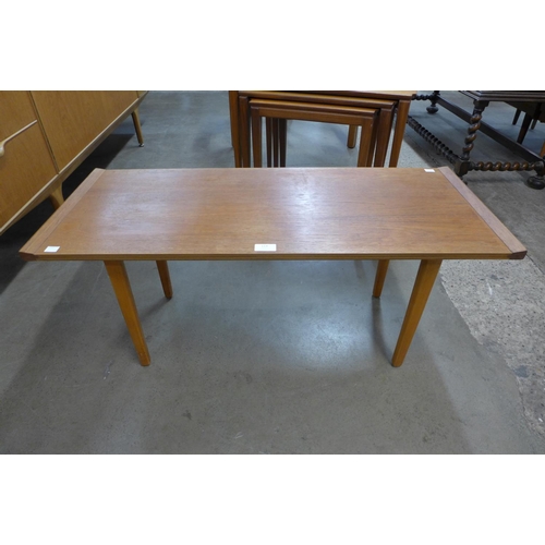 114 - A teak coffee table