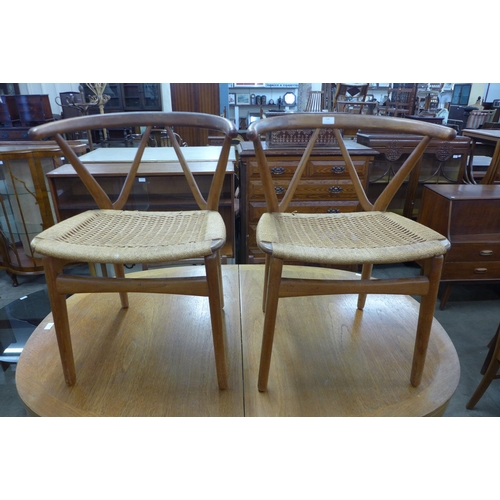 120 - A pair of Danish Henning Kjaernulf for Bruno Hansen model 225 teak and cord seated chairs