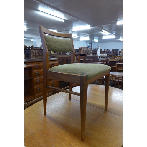 145 - A teak drop-leaf table and four chairs