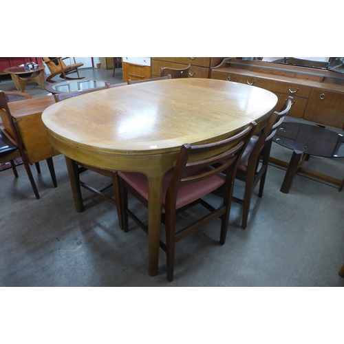 150 - A Nathan teak dining table and four chairs