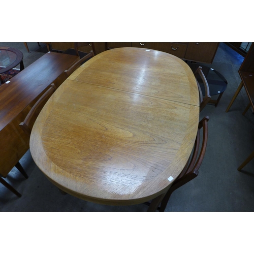 150 - A Nathan teak dining table and four chairs