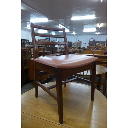 150 - A Nathan teak dining table and four chairs