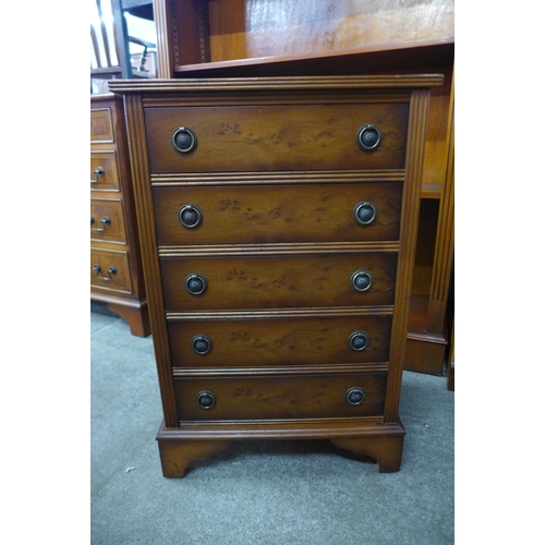 176 - A small yew wood chest of drawers