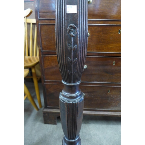 194 - A Hepplewhite Revival carved mahogany torchere