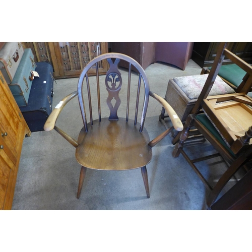 254 - An Ercol Golden Dawn elbow chair