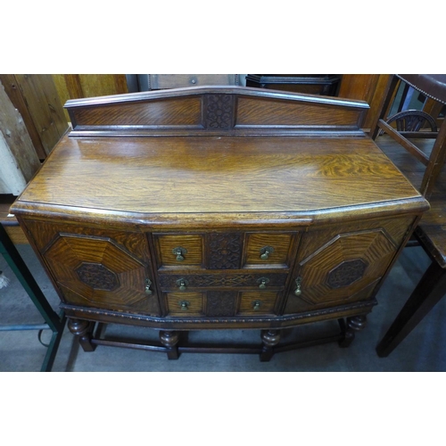 271a - A carved oak sideboard