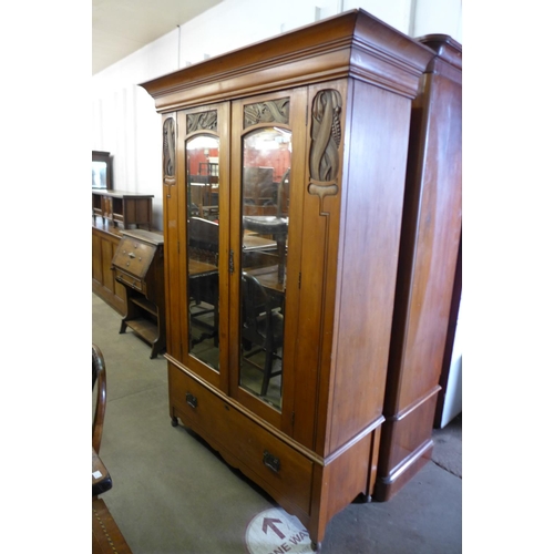 275 - A Victorian satin birch wardrobe