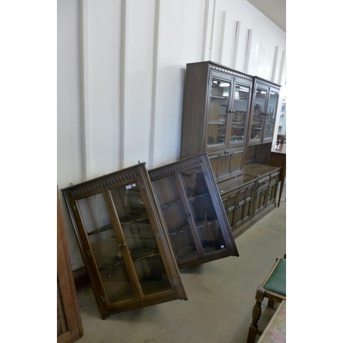 295 - A pair of Ercol Old Colonial bookcases and a pair of hanging corner cabinets