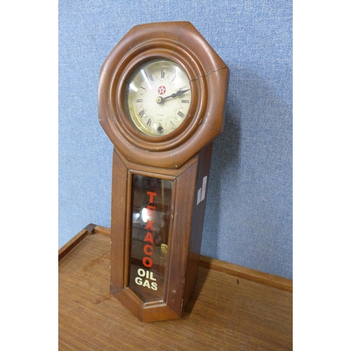 360 - A walnut wall hanging timepiece, bearing Texaco Oil Gas inscription to the door