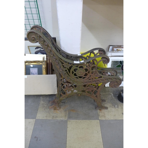 381 - A pair of cast iron bench ends