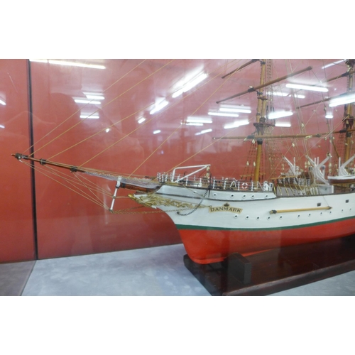 49 - A Danmark model three mast ship, cased, 65cms h, 113cms w, 36cms d