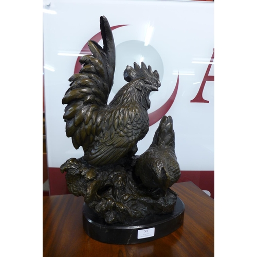 53 - A large bronze figure of bantam chickens, on black marble plinth, 48cms h