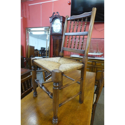 60 - An oak refectory table and four chairs