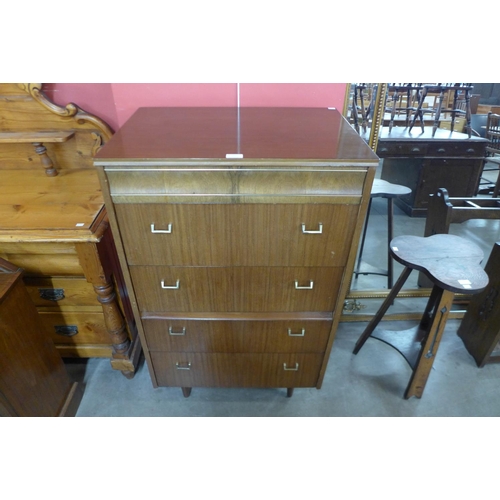 70 - A tola wood chest of drawers