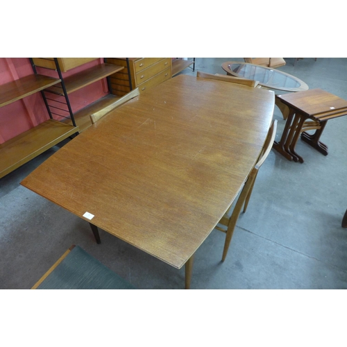 72 - A Mcintosh teak extending dining table and four chairs