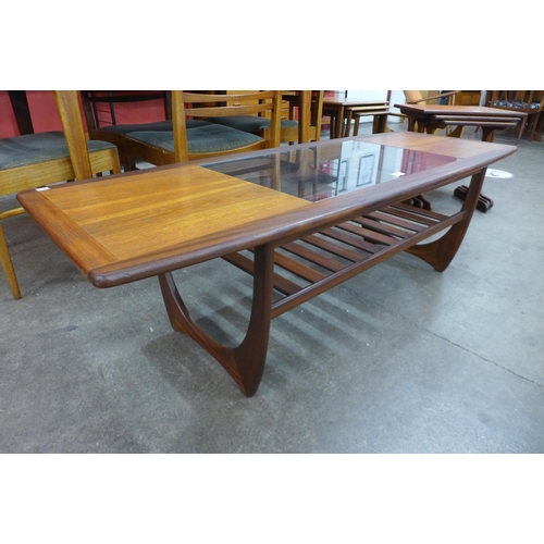 74 - A G-Plan Fresco teak and glass topped coffee table