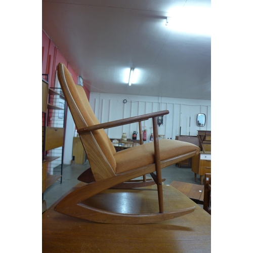 78 - A Danish Kubus Boomerang teak and orange fabric rocking chair, model no. 97, designed by Georg Jense... 