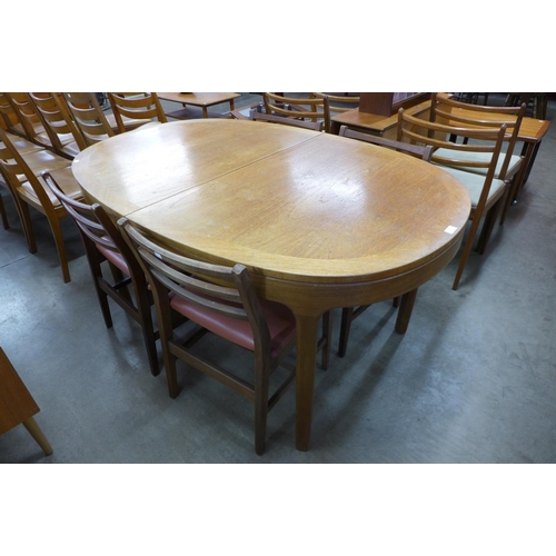 165 - A Nathan teak dining table and four chairs