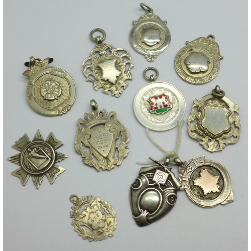 1005 - Ten silver fobs, 73g, and one white metal fob, one loop a/f