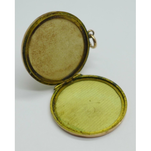 1021 - A 9ct gold back and front locket, total weight 4.6g, with initials