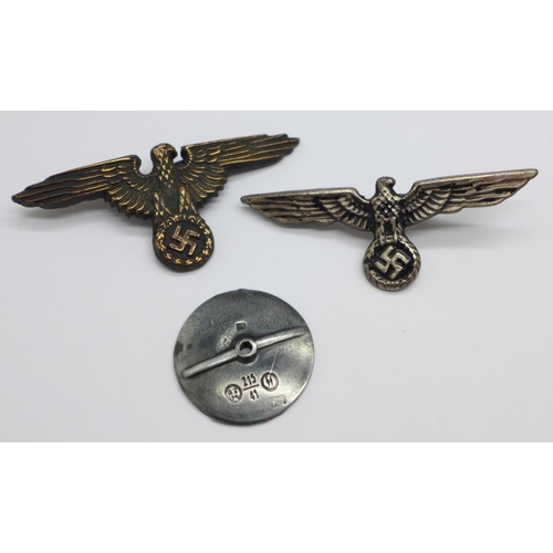 1037 - Two reproduction German badges and a badge screw back