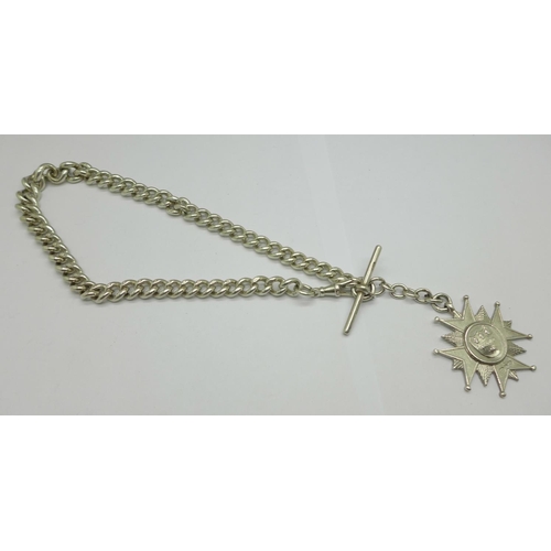 1061 - A silver Albert chain, each graduated link marked, with a large Victorian silver fob, 104g, 39cm