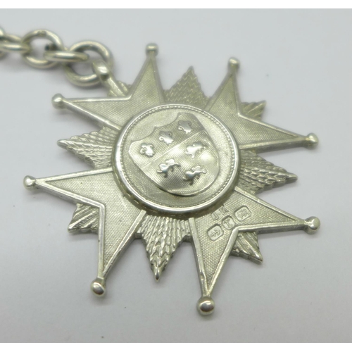 1061 - A silver Albert chain, each graduated link marked, with a large Victorian silver fob, 104g, 39cm