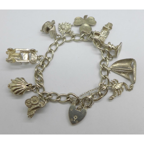 1067 - A silver charm bracelet, 42g