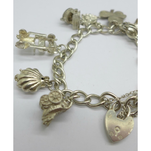 1067 - A silver charm bracelet, 42g