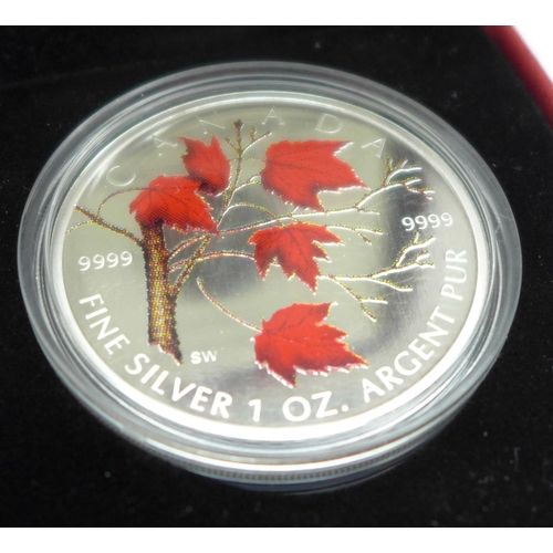 1068 - A Royal Canadian Mint 2004 Silver Maple Leaf Coloured Coin, one ounce fine silver, with box