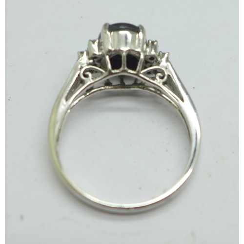 1085 - A white metal, cats eye and diamond set ring, marked 18k, 5.4g, V