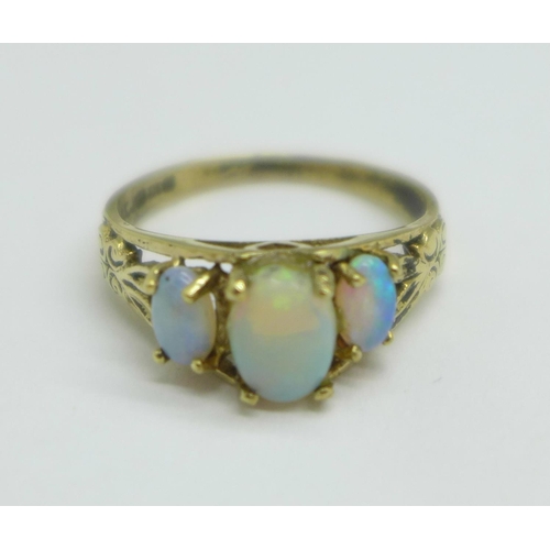 1098 - A 9ct gold, three stone opal ring, a/f, small chip on centre stone, one other stone reset, 2.1g, N