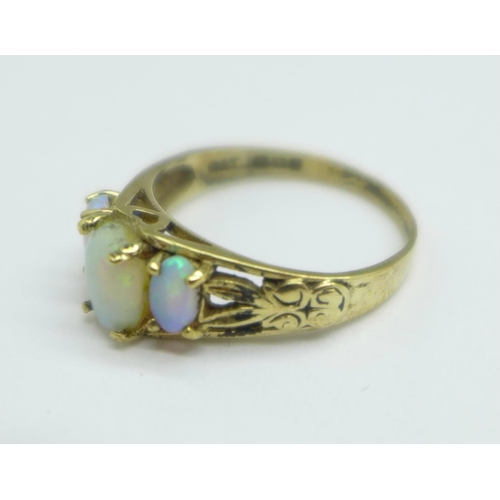 1098 - A 9ct gold, three stone opal ring, a/f, small chip on centre stone, one other stone reset, 2.1g, N