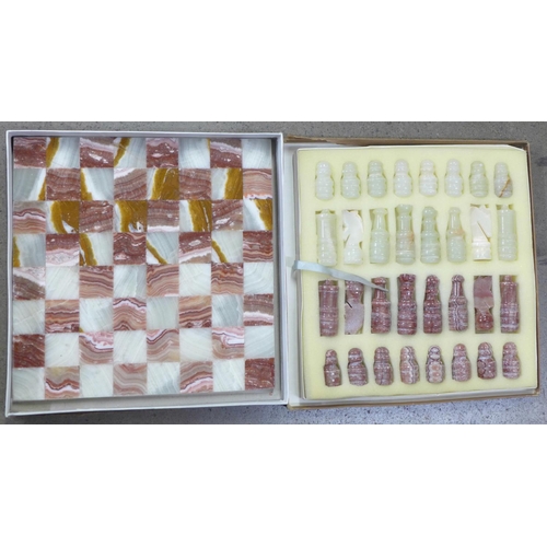 1108 - A carved onyx chess set