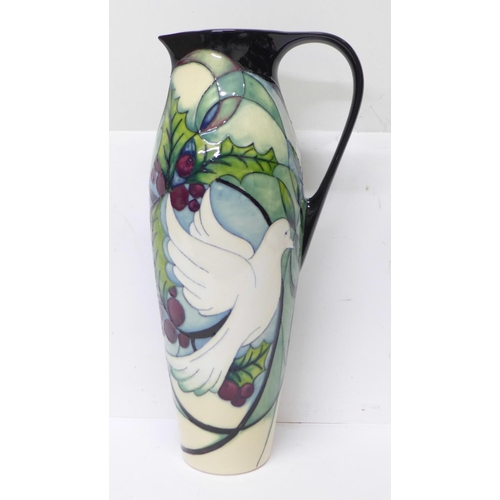 601 - A Moorcroft jug, Cathedral Window doves, 27cm, second