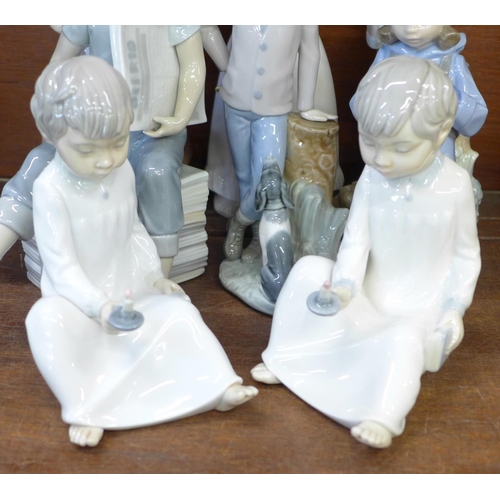 672 - A collection of eleven Nao by Lladro figures, boy sitting a/f