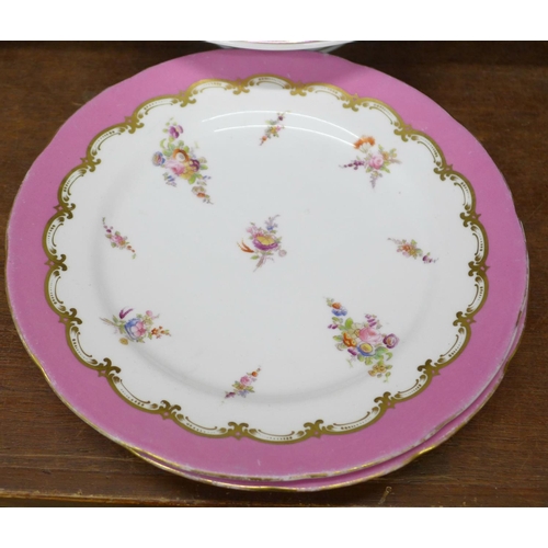 680 - Nine plates and two cake stands decorated with hand painted flowers