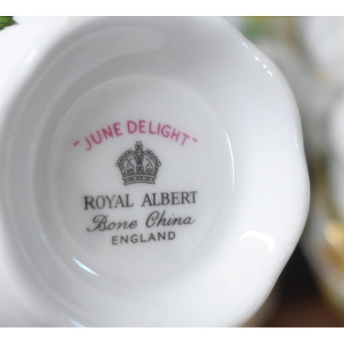 683 - A collection of Royal Stafford decorative teawares and four Royal Albert June Delight cups and sauce... 