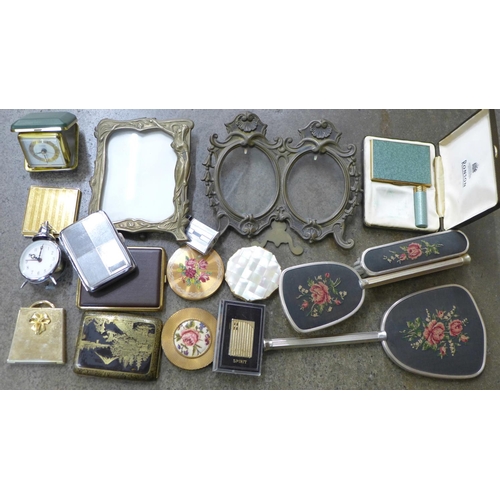 693 - A collection of cigarette cases, lighters, two brass photograph frames, vanity set, etc.