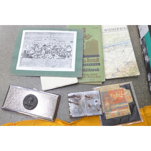 695 - A collection of Militaria; ephemera, map, German Mother's Cross medal, reproduction cigarette box, e... 