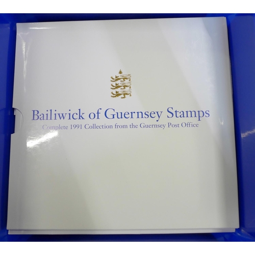 730 - A large collection of Guernsey stamps; 14x yearbooks of mint stamps 1985-1998, a Lindner   album of ... 