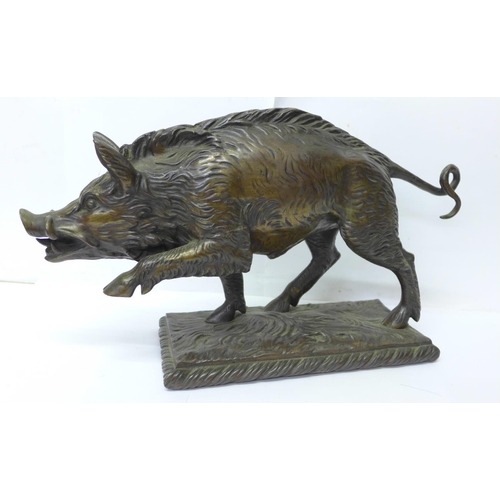 758 - A bronze model of a wild boar, signed T Carter under the base, 33cm, 4.62kg