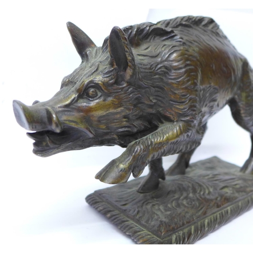 758 - A bronze model of a wild boar, signed T Carter under the base, 33cm, 4.62kg