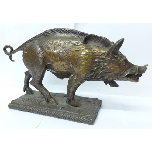 758 - A bronze model of a wild boar, signed T Carter under the base, 33cm, 4.62kg