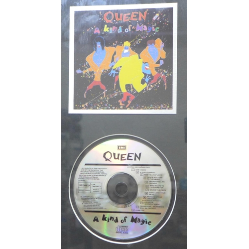 765 - A limited edition CD album, Queen A Kind of Magic with photograph and album cover, 129/1500