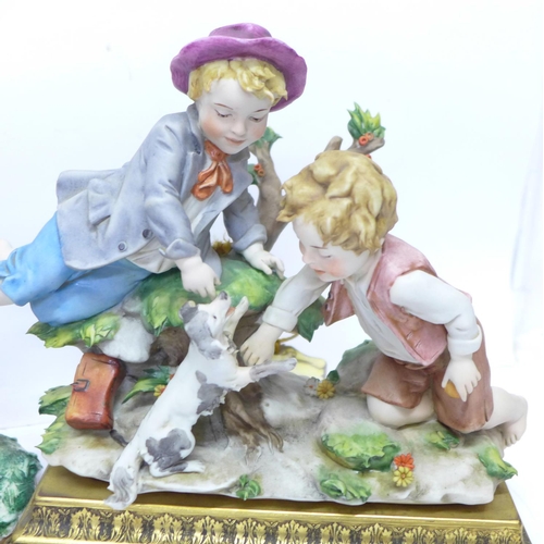 766 - Two Capodimonte figure groups, both signed, one mounted on a brass stand