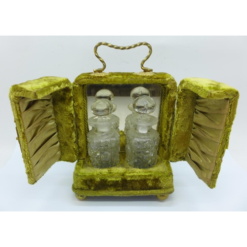 794 - A pair of glass scent bottles, in a green velvet covered case