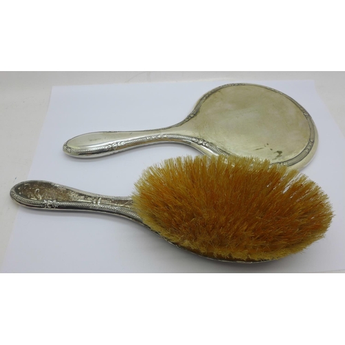 795 - A silver backed mirror and brush