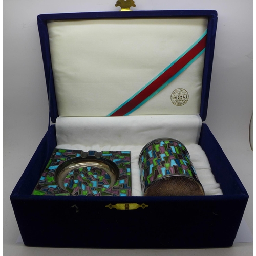 797 - A silver and enamel ashtray and cigarette dispenser, marked on each base 'Silver 99%', 575g, boxed